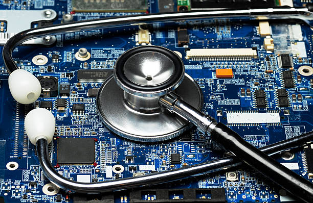 computer circuit board and stethoscope on top closeup